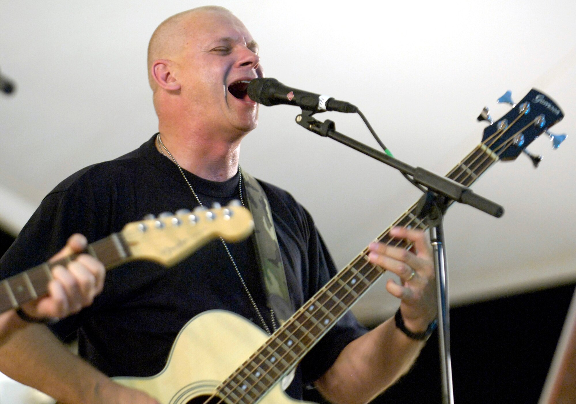 Master Sgt. Bill Swanberger of the U.S. Central Air Forces Expeditionary Band "Thunder Roll" performs at a concert in Southwest Asia June 16. "Thunder Roll," along with a second CENTAF band, "Live Round," are bringing a touch of home to servicemembers fighting the war on terrorism.  Sergeant Swanberger is with the Illinois Air National Guard. (U.S. Air Force photo/Master Sgt. Jim Varhegyi) 