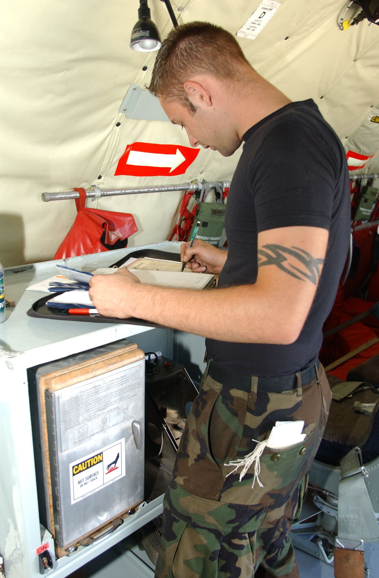 Senior Airman Joshua Terry, 319th Aircraft Maintenance Squadron, completes an inspection form during the maintenance of the KC-135 that will be taken to this year’s Rodeo competition at McChord Air Force Base, Wash. Airman Terry is the team’s hydraulics specialist. (U.S. Air Force photo/Staff Sgt. Amanda Callahan)