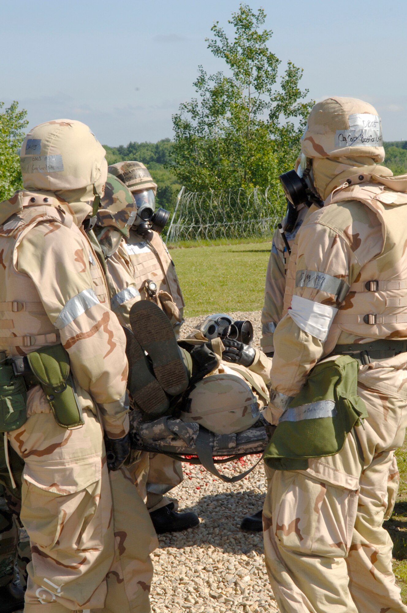 "Deployed troops" practice Self-Aid and Buddy Care at Camp Patriot during Hanscom's Operational Readiness Inpsection. Throughout the ORI base personnel were put to the test by more than 70 Air Force Materiel Command inspectors on such topics as intial reponse, emergeancy management and deployed operations readiness. (US Air Force photo by Jan Abate)