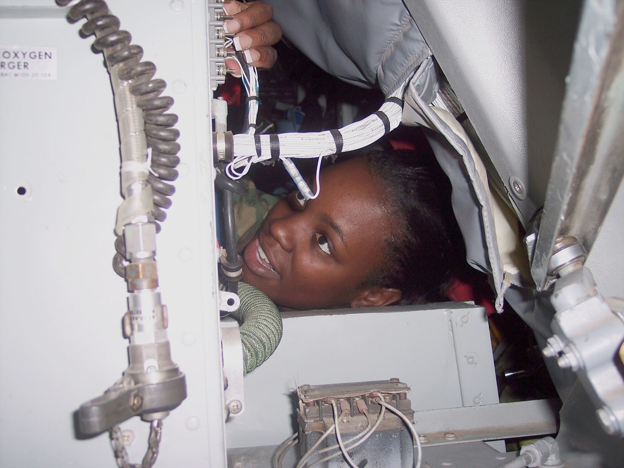 Staff Sgt. Khristen Huey-Davies, a communications and navigation specialists on the Grand Forks Air Force Base Rodeo team, tightens terminal lugs on the KC-135 that will be taken to the Air Mobility Rodeo competition. Sergeant Davies is joining 23 other Warriors of the North competing in this year’s Rodeo at McChord Air Force Base, Wash. (U.S. Air Force photo/Capt. Joseph Cole)