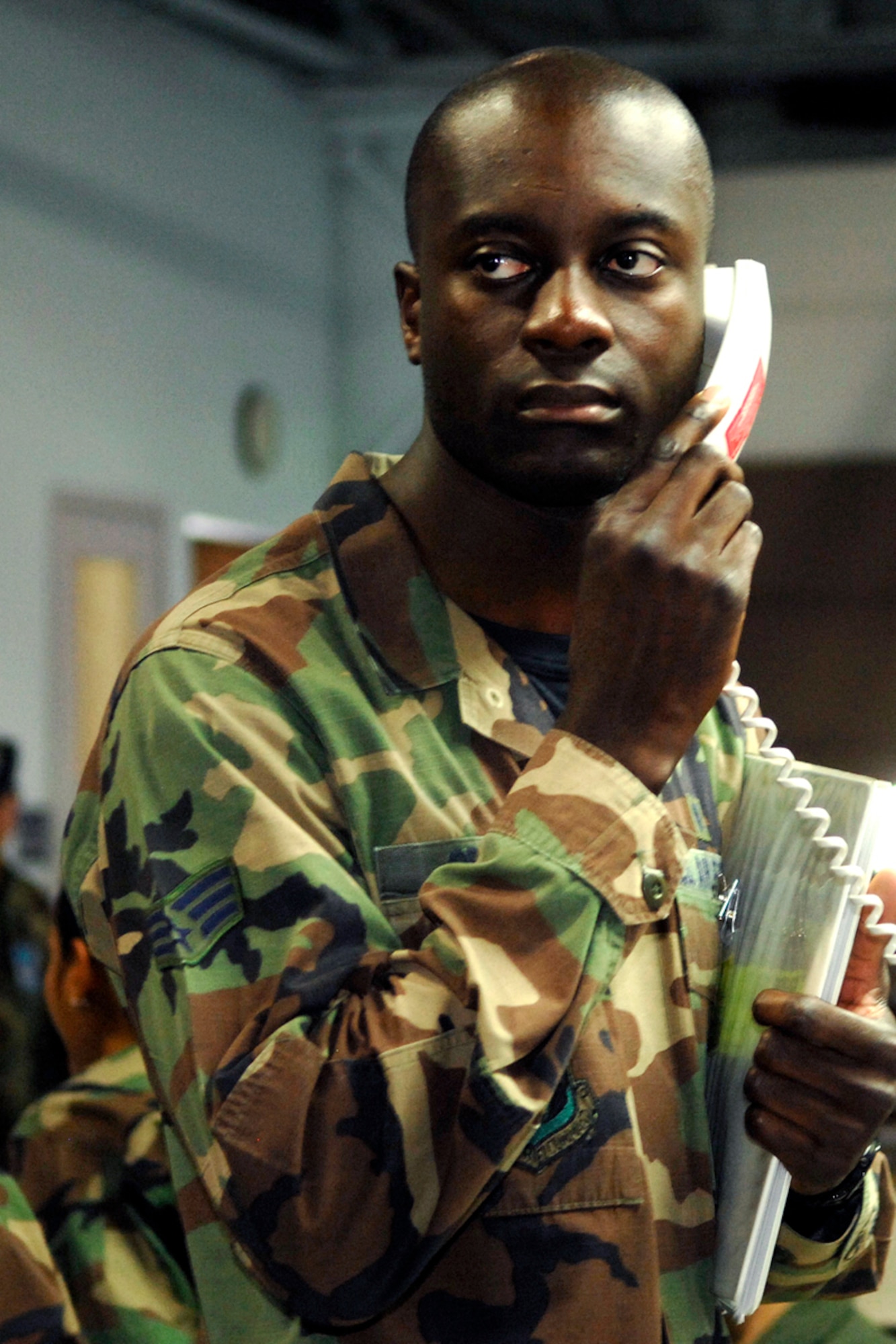 Senior Airman Evans Opoku, 66th Medical Operations Squadron, makes a phone call during the Personnel Deployment Function line processing during Hanscom's Operational Readiness Inspection. The ORI began on June 7 and ran until June 18. (US Air Force photo by Linda LaBonte Britt)