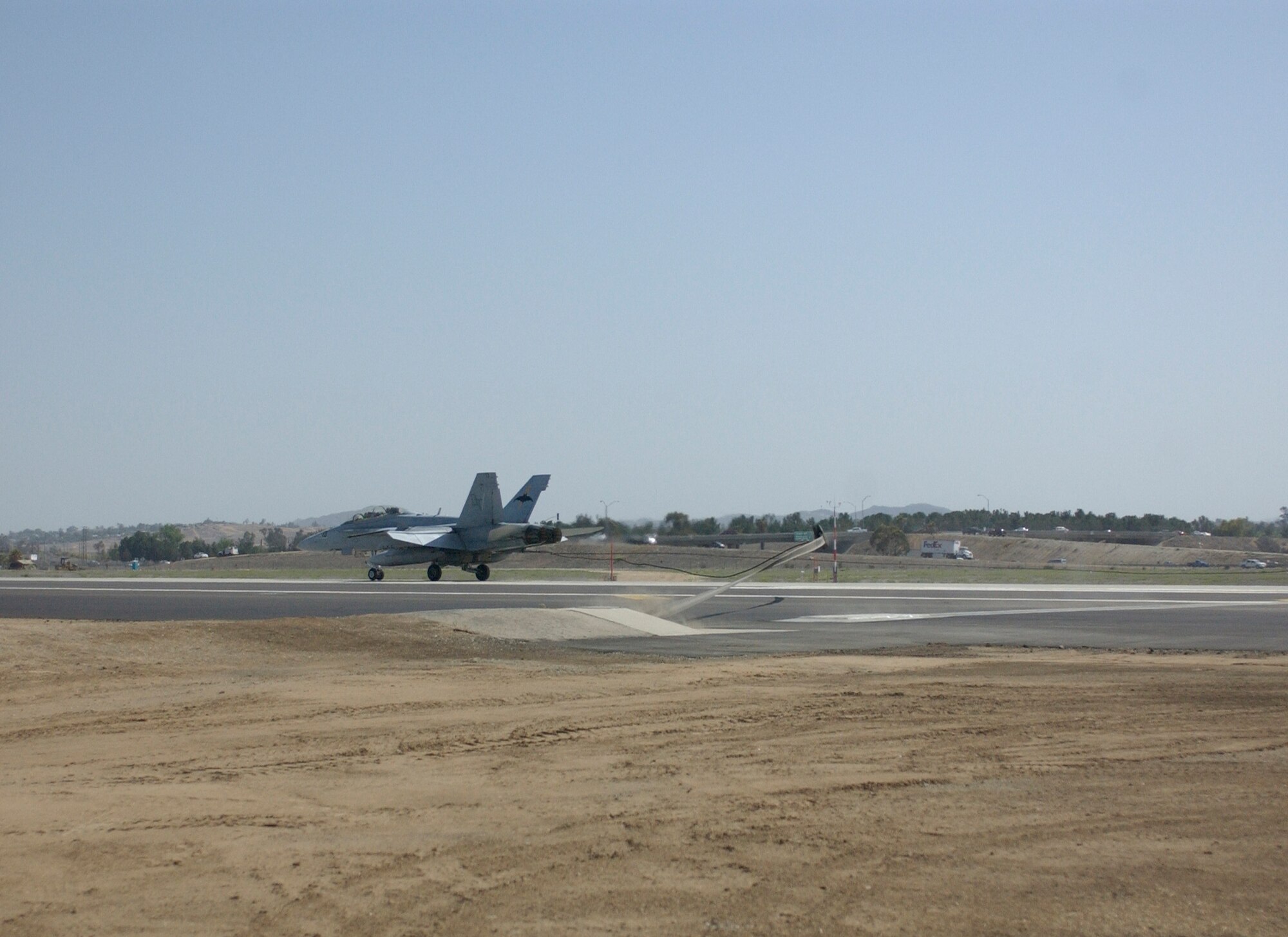 An F/A-18D Hornet from Marine Corps Air Station, Miramar, Calif., conducted
the initial certification of the north end retractable barrier at March Air Reserve Base last week. Construction for the south end barrier will begin in late June. (U,S. Air Force photo by Amy Abbott, 452 AMW/PA)