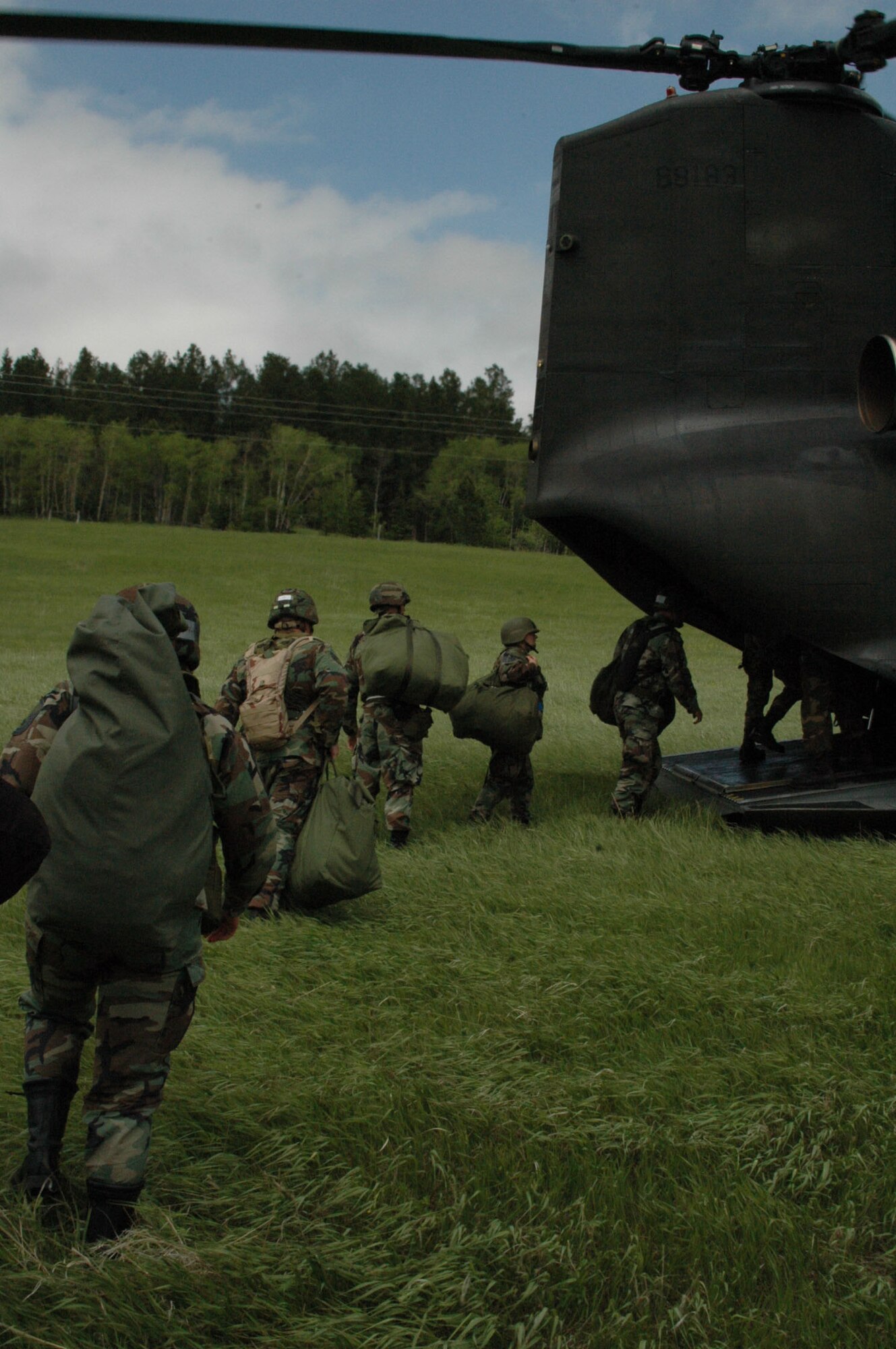 After completing the aircraft accident training, Ellsworth's Airmen board a CH-47 and ride back to the base.
Airmen participated in Joint Thunder 2007 for the first time in the exercise's existence. Joint Thunder is a realistic field training exercise which includes Army, Navy and Air Force units from 34 states, Canada, Singapore and Germany. Joint Thunder exercises provide better trained medics who are fully prepared to support the Global War on Terror, also it builds a better joint medical team. Medics gain knowledge on convoy operations, receive training in land navigation and participate in the Leadership Reaction Course. 
(U.S Air Force photo/Airman 1st Class Kimberly Moore Limrick)