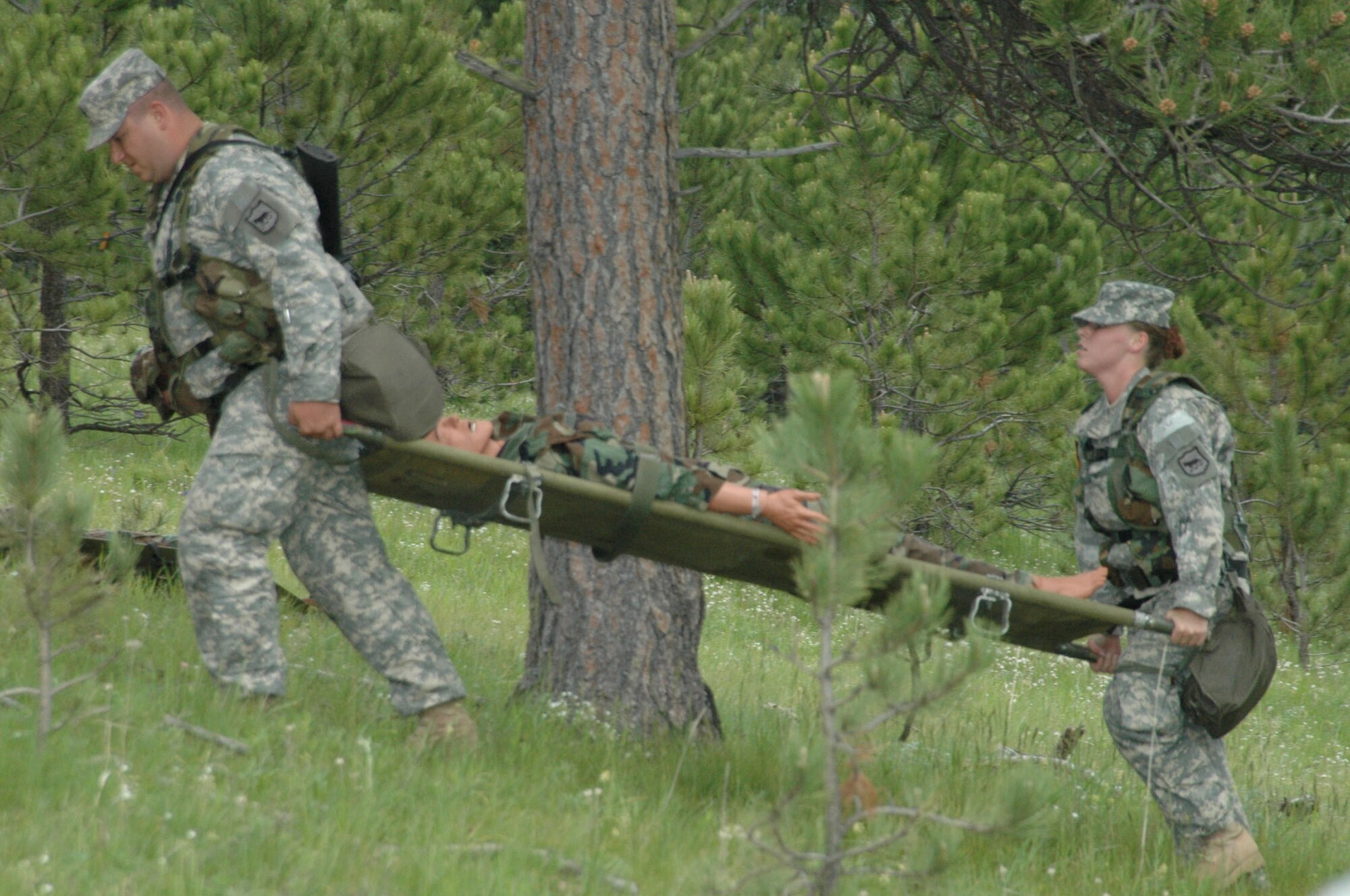 Airmen participate in Joint Thunder 2007 for the first time in the exercise's existence. Joint Thunder is a realistic field training exercise which includes Army, Navy and Air Force units from 34 states, Canada, Singapore and Germany. Joint Thunder exercises provide better trained medics who are fully prepared to support the Global War on Terror, also it builds a better joint medical team. Medics gain knowledge on convoy operations, receive training in land navigation and participate in the Leadership Reaction Course. 
(U.S Air Force photo/Airman 1st Class Kimberly Moore Limrick)