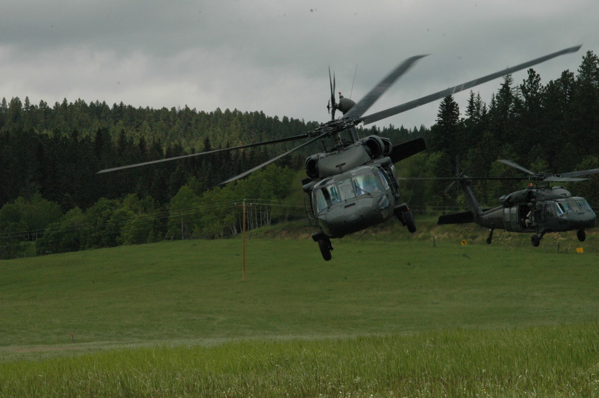 Black Hawk helicopters take off as a part of training during Joint Thunder 2007. Joint Thunder is a realistic field training exercise which includes Army, Navy and Air Force units from 34 states, Canada, Singapore and Germany.  The Joint Thunder exercise provides medics better training for preparation in support of the Global War on Terror, also it builds a better joint medical team. Medics gain knowledge on convoy operations, receive training in land navigation and participate in the Leadership Reaction Course. 
(U.S Air Force photo/Airman 1st Class Kimberly Moore Limrick)
