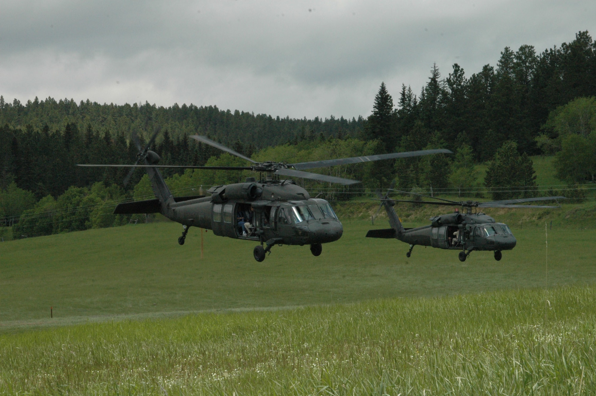 Black Hawk helicopters take off as a part of training during Joint Thunder 2007. Joint Thunder is a realistic field training exercise which includes Army, Navy and Air Force units from 34 states, Canada, Singapore and Germany.  The Joint Thunder exercise provides medics better training for preparation in support of the Global War on Terror, also it builds a better joint medical team. Medics gain knowledge on convoy operations, receive training in land navigation and participate in the Leadership Reaction Course. 
(U.S Air Force photo/Airman 1st Class Kimberly Moore Limrick)
