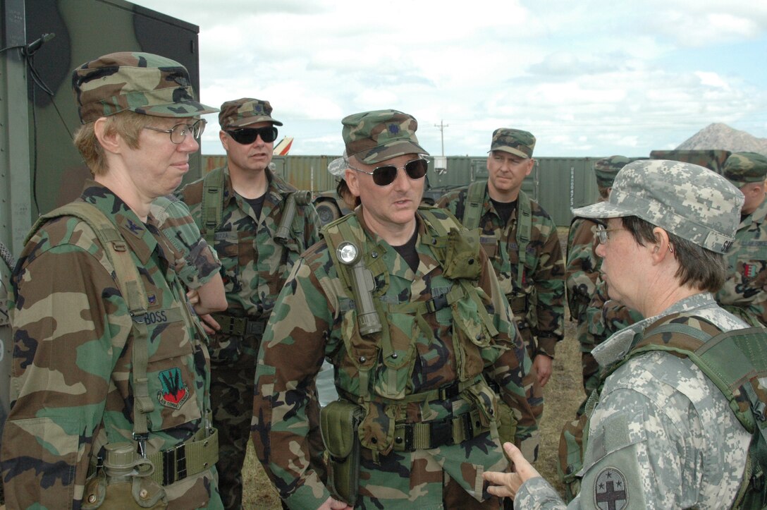 Col. Naomi Boss, 28th Medical Group commander and Lt. Col. Tom Greenlee, 28th Medical Support Squadron commander meet with Army Col. Jacqueline Smith, 345th Combat Support Hospital commander, during a tour of Sturgis field for exercise Joint Thunder June 16. “The Army and Air Force working together is a match made in heaven.” Colonel Smith said. (U.S. Air Force photo/Tech. Sgt. Todd Wivell)
