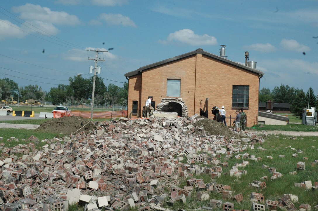 The aftermath of the chimney demolition that was held June 16, of a 55 year-old chimney. Eight pounds of a two-component explosive were used in the demolition of the 95-foot high chimney. (U.S. Air Force photo/Airman Nathan Riley)