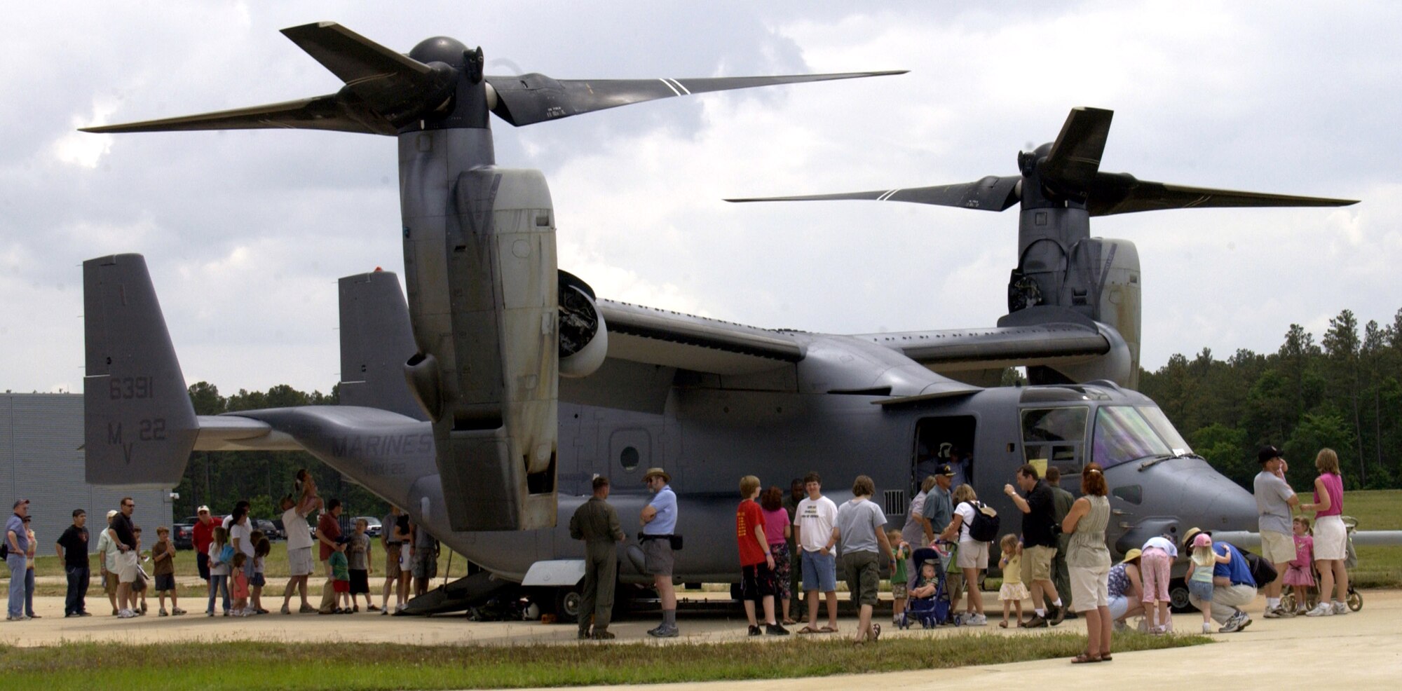 Visitors gather around a Marine MV-22 Osprey at the "Reach for the Sky" family day at the National Air and Space Museum's Udvar-Hazy Center in Chantilly, Va.  The airshow featured several static civilian and military aircraft in addition to the museum's vast array of air and space displays. More than 17,000 people attended the event, which also honored the Air Force's 60th Anniversary as a separate service.  (U.S. Air Force photo/Staff Sgt. J.G. Buzanowski) 