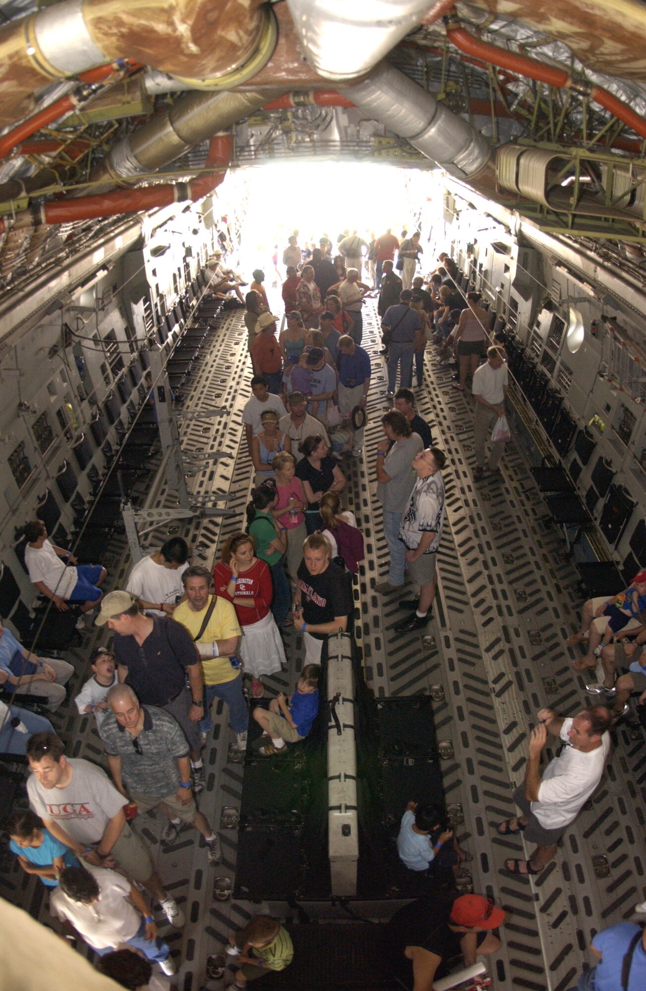 Visitors get an inside look at a C-17 Globemaster III during the "Reach for the Sky" family day at the National Air and Space Museum's Udvar-Hazy Center in Chantilly, Va.  The airshow featured several static civilian and military aircraft in addition to the museum's vast array of air and space displays. More than 17,000 people attended the event, which also honored the Air Force's 60th Anniversary as a separate service.  The C-17 is from the 97th Air Mobility Wing, Altus Air Force Base, Okla.  (U.S. Air Force photo/Staff Sgt. J.G. Buzanowski) 