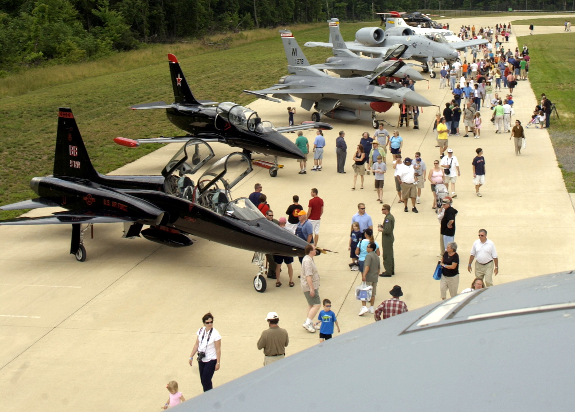 Visitors have a chance to speak with Airmen and marvel at aircraft during the "Reach for the Sky" family day at the National Air and Space Museum's Udvar-Hazy Center in Chantilly, Va.  The airshow featured several static civilian and military aircraft in addition to the museum's vast array of air and space displays. More than 17,000 people attended the event, which also honored the Air Force's 60th Anniversary as a separate service.  (U.S. Air Force photo/Staff Sgt. J.G. Buzanowski) 