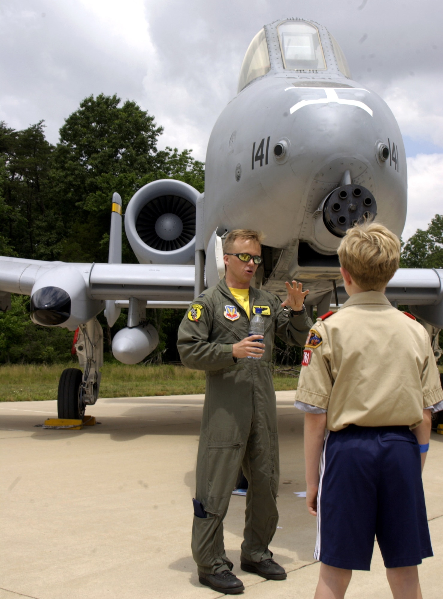 Capt. Britt Warren talks with a visitor about the A-10 Thunderbolt II during the "Reach for the Sky" family day at the National Air and Space Museum's Udvar-Hazy Center in Chantilly, Va.  The airshow featured several static civilian and military aircraft in addition to the museum's vast array of air and space displays. More than 17,000 people attended the event, which also honored the Air Force's 60th Anniversary as a separate service.  Captain Warren is an instructor pilot with the 357th Fighter Squadron from Davis-Monthan Air Force Base, Ariz.  (U.S. Air Force photo/Staff Sgt. J.G. Buzanowski) 