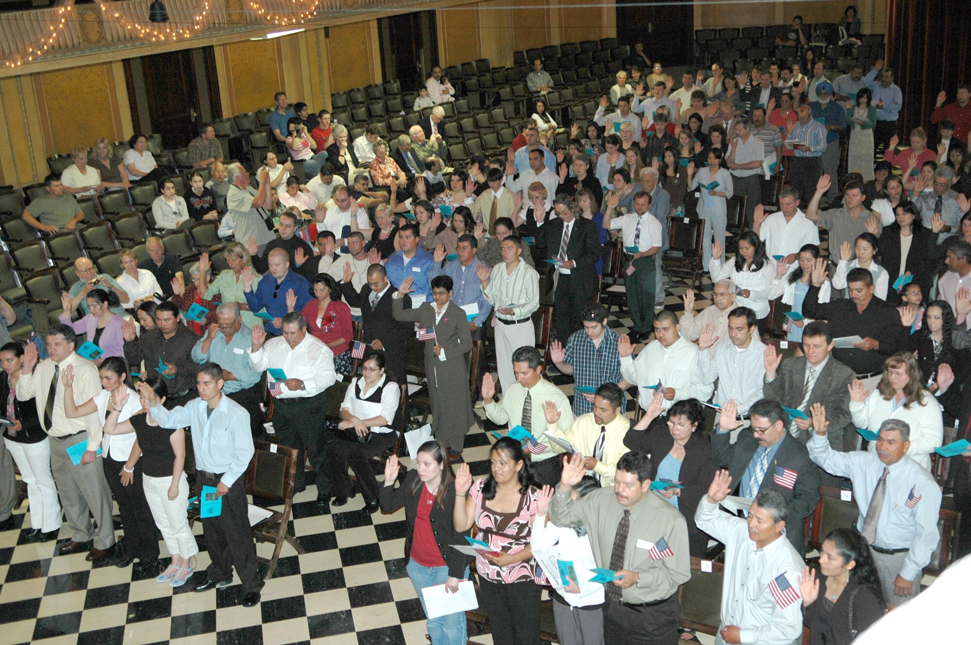 SPOKANE, Wash. -- On Flag Day, June 14, 139 new U.S. citizens from 24 different countries take their Oath of Allegiance during an induction ceremony held in the Masonic Temple here. Col. Robert Egbert, 92nd Maintenance Group commander at Fairchild Air Force Base, Wash., was guest speaker at the ceremony and handed each new citizen their naturalization certificate. (U.S. Air Force photo/Joe Wiles)
