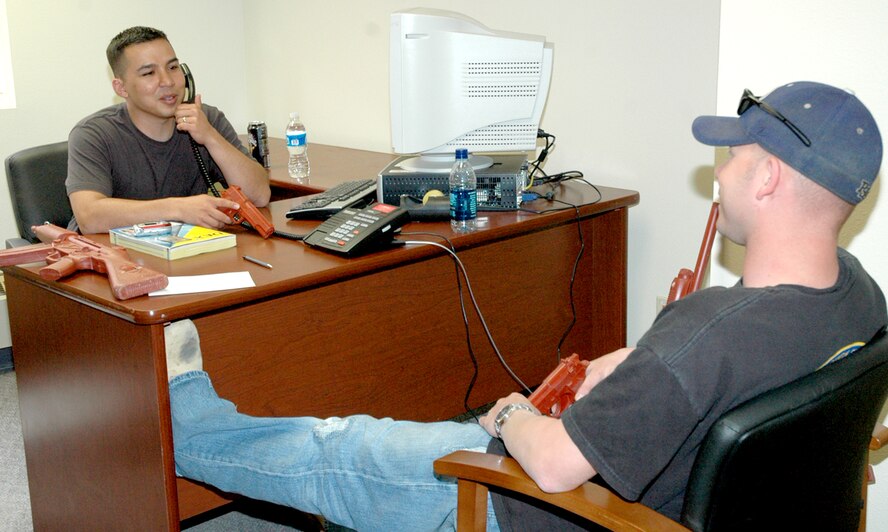 Tech. Sgt. William Murphy and Staff Sgt. Douglas Bolton, 90th Security Forces Group, play the roles of kidnappers during the exercise, testing negotiators and response forces.
