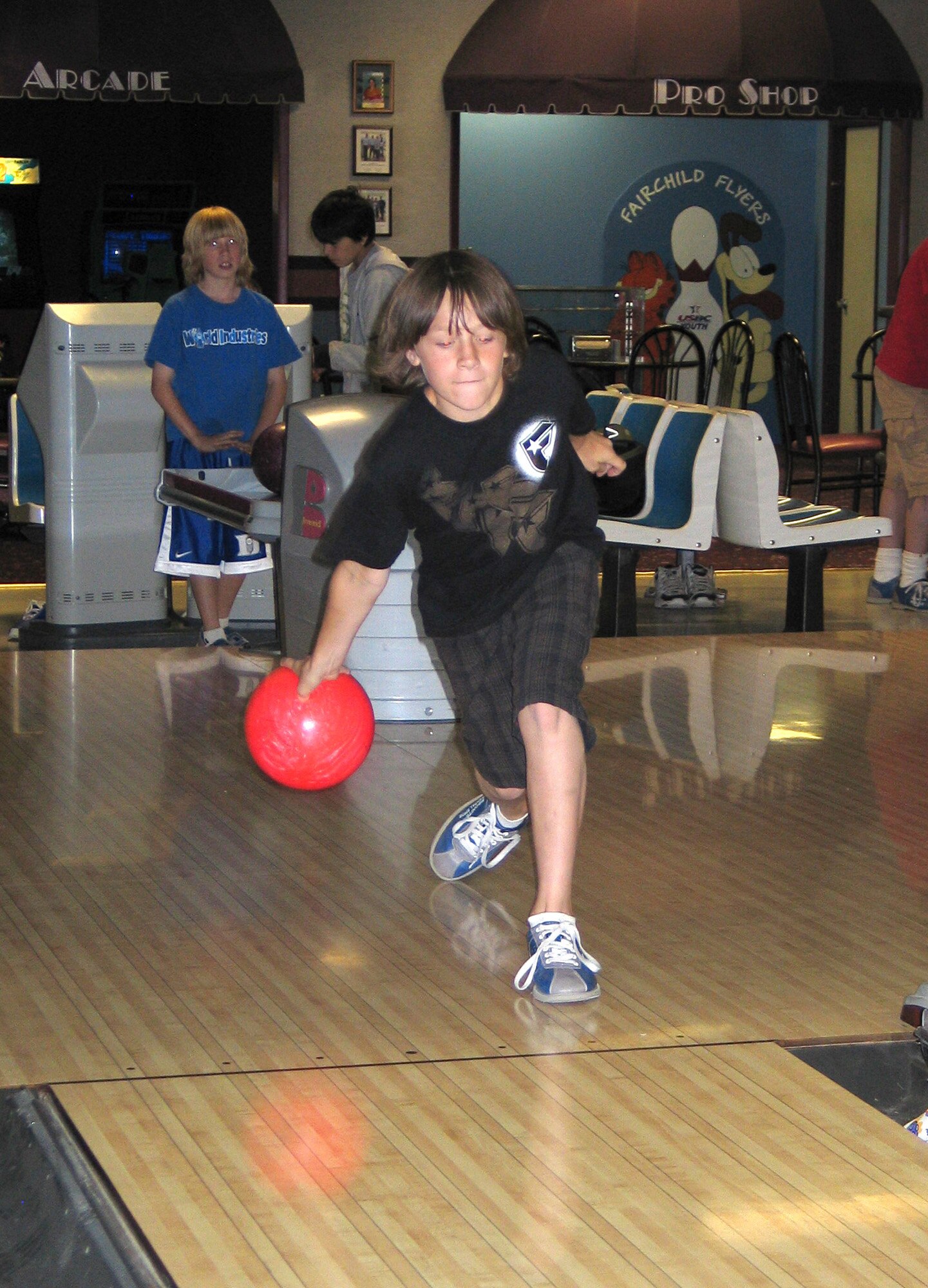FAIRCHILD AIR FORCE BASE, Wash. – Drew Williams, 10, goes for a strike at the Fairchild Funspot June 14. Drew, a 4th –grader at Trinity Catholic School in Spokane, Wash., was one of 100-plus students to visit the base for a school outing. The field trip ended the students’ school year on a positive note, as school let out June 15. (U.S. Air Force photo/Staff Sgt. Connie L. Bias)
