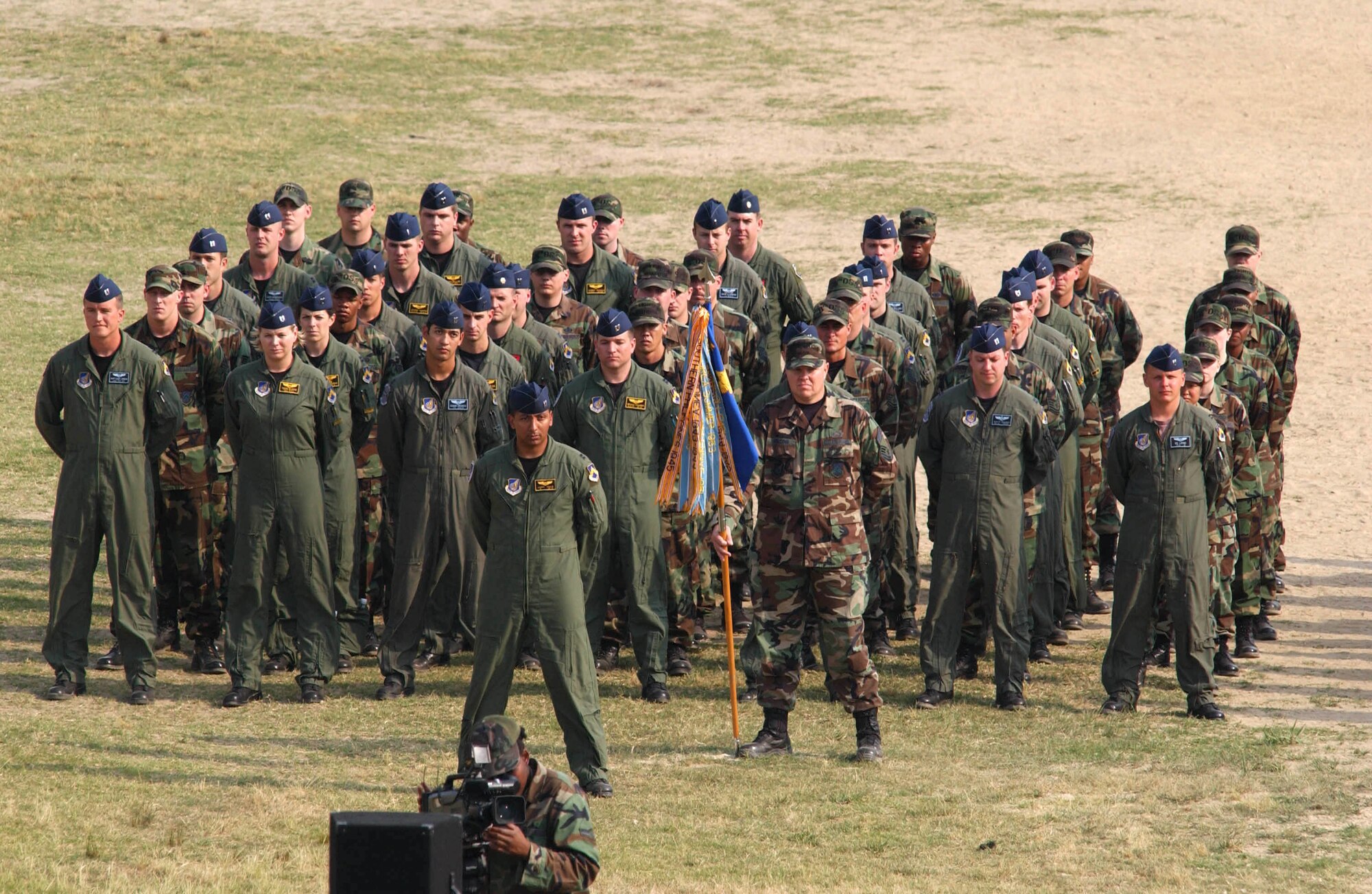 KUNSAN AIR BASE, Republic of Korea -- Airmen from the 35th and 80th Fighter Squadrons stand in formation during the wing's commemoration event June 19.  The memorial service honored the memory of "Wolf 1", Brig. Gen. Robin Olds, who recently passed away. (U.S. Air Force Photo/Senior Airman Steven R. Doty)                              