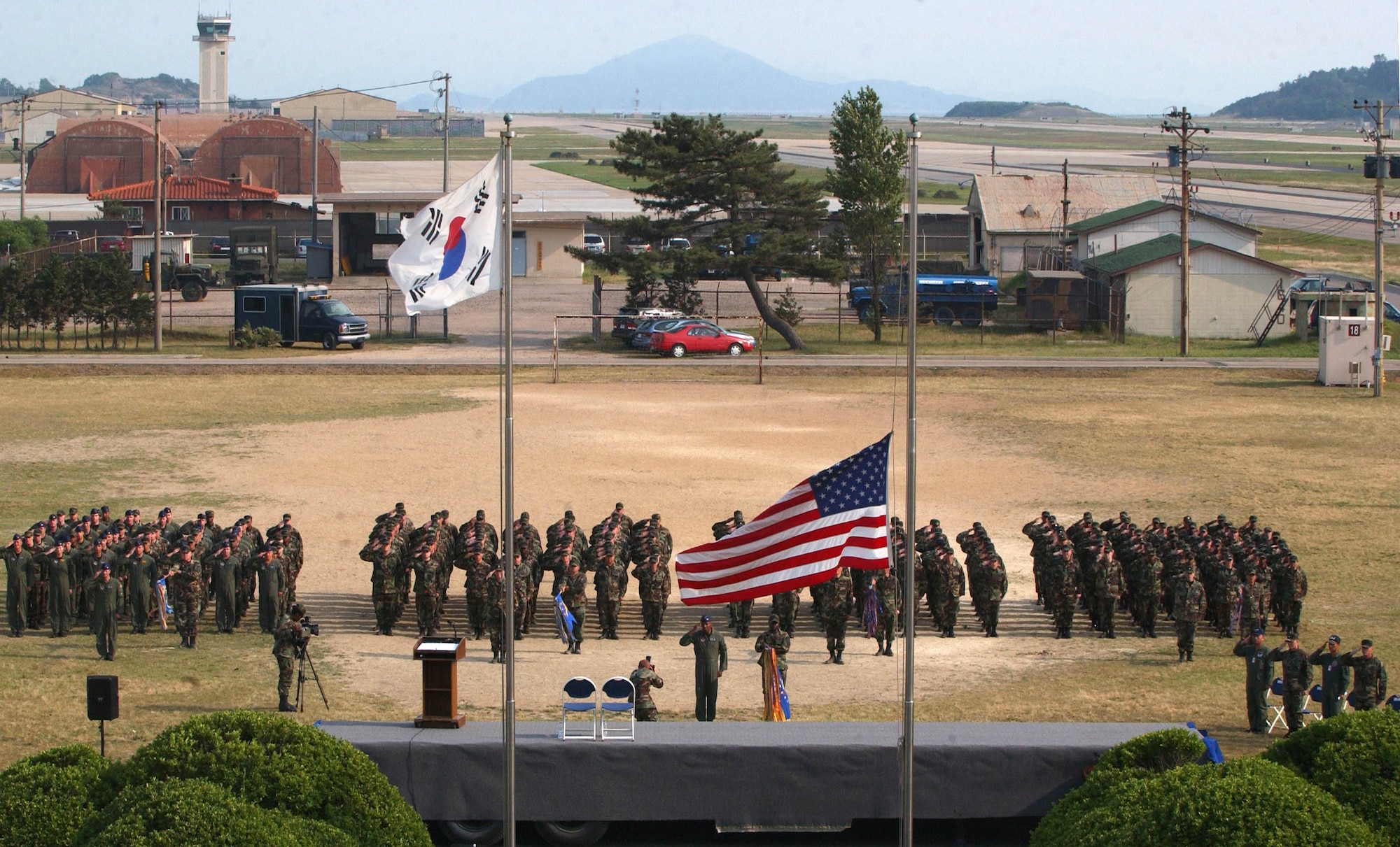 KUNSAN AIR BASE, Republic of Korea -- Airmen from the 8th Fighter Wing salute for retreat during the wing's commemoration event June 19.  The memorial service honored the memory of "Wolf 1", Brig. Gen. Robin Olds, who recently passed away.  (U.S. Air Force Photo/Senior Airman Steven R. Doty)                               