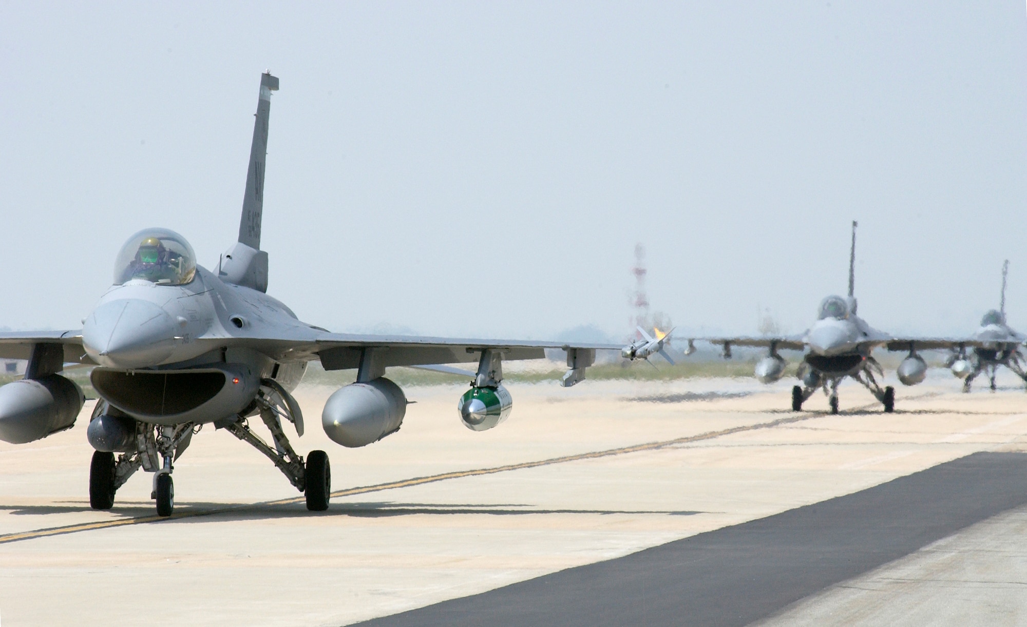 KUNSAN AIR BASE, Republic of Korea -- F-16's from the 555th Fighter Squadron, Aviano Air Base, Italy, arrive at Kunsan Air Base, Republic of Korea for their 120 day deployment.  This is the first time that a United States Air Forces in Europe base has deployed to a Pacific Air Force base.  (US Air Force photo/Senior Airman Barry Loo)