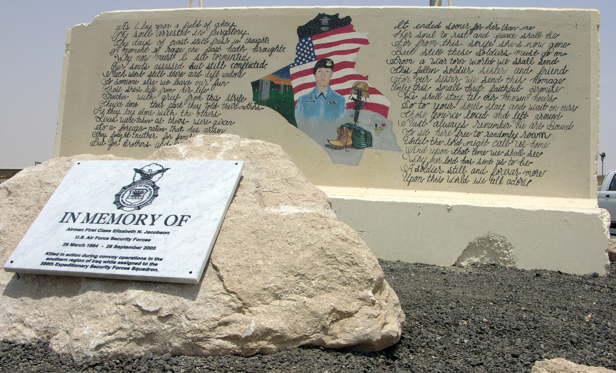SOUTHWEST ASIA -- Members of the 386th Expeditionary Security Forces Squadron recently completed work updating and retouching Jacobson Barrier, a memorial dedicated to Airman 1st Class Elizabeth Jacobson, who was killed in action Sept. 28, 2005 while performing convoy security duties in support of Operation Iraqi Freedom. (U.S. Air Force photo by Senior Airman Andrew Dumboski)