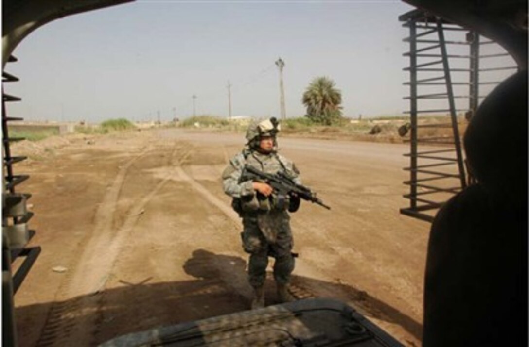 Soldiers from 1st Squadron, 14th Cavalry Regiment, 3rd Stryker Brigade Combat Team, 2nd Infantry Division from Fort Lewis, Wash., patrol Chibernat, a village on the outskirts of Baqouba, Iraq. This operation is part of a continuing effort to clear areas suspected of harboring terrorists.