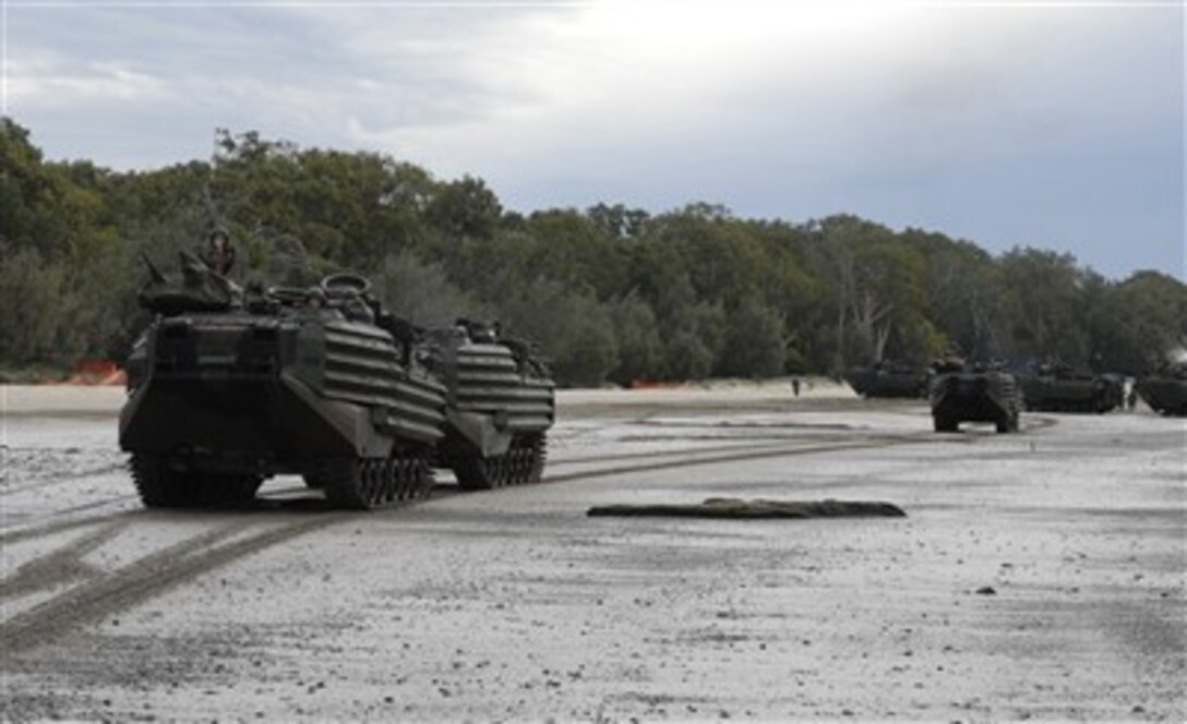 U.S. Marine Corps assault amphibian vehicles from the 3rd Marine Expeditionary Brigade, 31st Marine Expeditionary Unit, hit the beach June 17, 2007, during an amphibious landing rehearsal for Exercise Talisman Saber 2007, at Shoalwater Bay Training Area, Australia. The exercise is a U.S. and Australian led Joint Task Force exercise designed to prepare both nations for crisis action planning and executing contingency operations.  