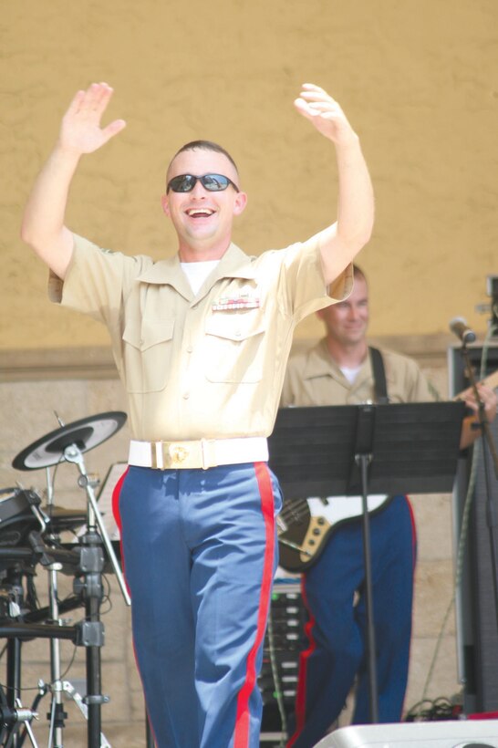 Staff Sgt. Rob Davies, a musician with the Parris Island Marine band, amps up the excitement during a gig at Daytona Beach, Fla.