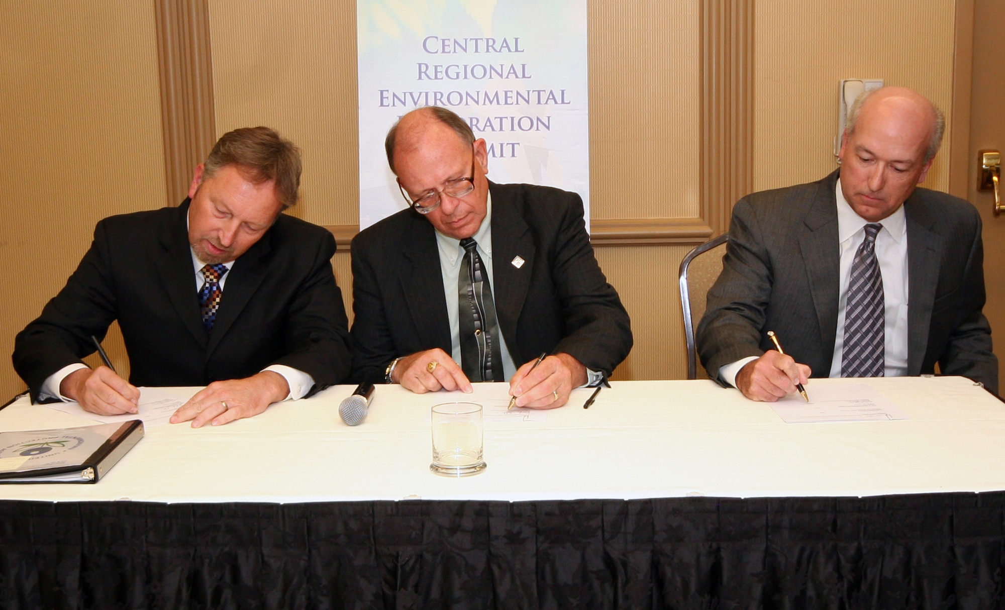 (Left to right) John Askew, U.S. Environmental Protection Agency Region 7, Doyle Childers, Director of Missouri Department of Natural Resources, and Robert Barrett, Air Combat Command Chief of the Asset Management Division of the Directorate of Installations and Mission Support, sign a Long-Term Stewardship Agreement for the Missouri Minuteman II Missile Sites, in Kansas City June 19. The agreement signifies the Air Force has satisfactorily completed required environmental steward actions in conjunction with the dismantling of the 165 missile silo and launch control facility sites active in the state throughout much of the Cold War. The Air Force will continue to monitor and inspect the sites to ensure compliance with restrictions placed upon landowners concerning use of the land. (U.S. Air Force photo/Tech. Sgt. Matt Summers)