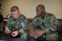MINOT AIR FORCE BASE, N.D. – Col. Myron Freeman (right), the new 91st Security Forces Group commander, and Tech. Sgt. Gerald Sullivan, 91st SFG, look over a map June 20, to prepare for an upcoming exercise. Colonel Freeman took command of the 91st SFG June 13. (U.S. Air Force photo by Senior Airman Danny Monahan)