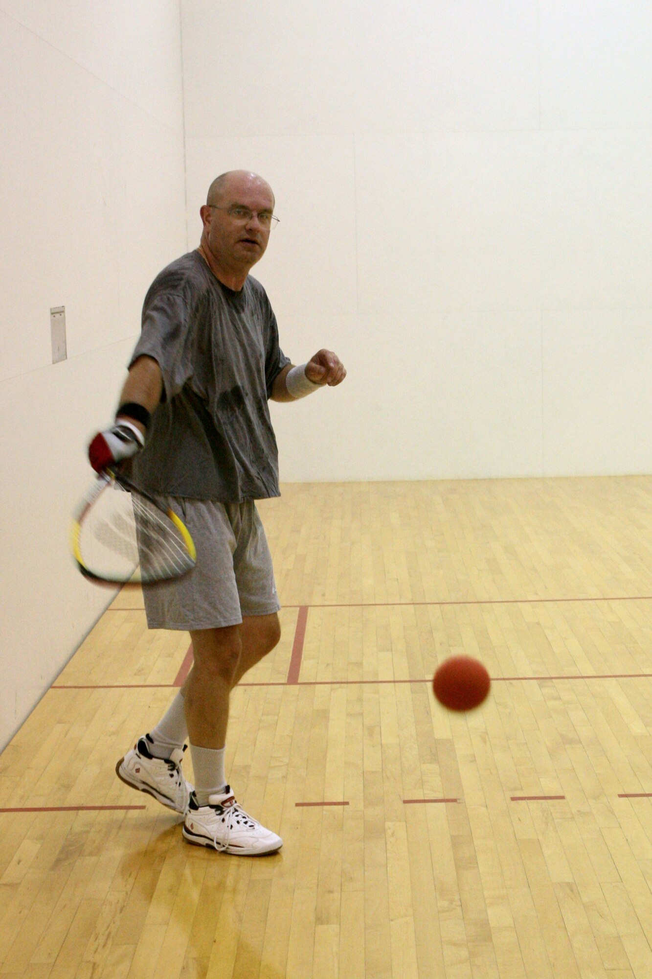 GRISSOM AIR RESERVE BASE, Ind. -- Kevin Yeager, from the 434th Mission Support Group, plays a ball off the back wall during a racketball match as part of a tournament sponsored by the 434th Services Flight. (U.S. Air Force photo/Senior Airman Omar Delacruz)