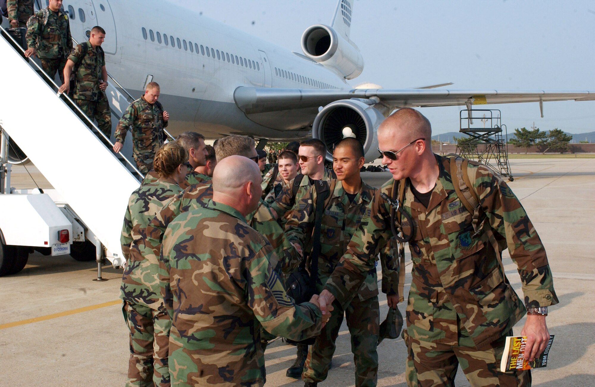 Airmen from the 555th Fighter Squadron from Aviano Air Base, Italy, load onto a bus June 18 at Kunsan Air Base, South Korea. Aviano AB Airmen are here for a 120-day deployment. This is the first time a U.S. Air Forces in Europe fighter unit has deployed to a Pacific Air Force base. (U.S. Air Force photo/Senior Airman Steven R. Doty) 
