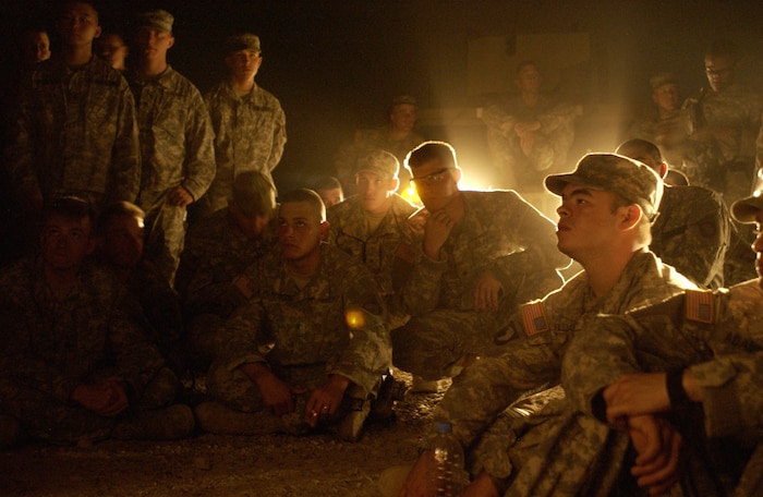 U.S. Army soldiers from Bravo company, 1-75 Cavalry, 101st Airborne Division, listen as they are given a mission briefing as they prepare to capture a high-value target July 4, 2006 in Baghdad, Iraq. (U.S. Air Force photo/Senior Airman Richard Rose)