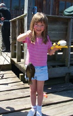 Sarah Ellingwood, daughter of Senior Master Sgt. Darren Ellingwood, 93rd Intelligence Flight NCOIC, poses with her "catch of the day."  (U.S. Air Force courtesy photo)