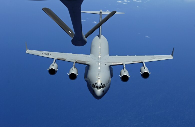 A C-17 Globemaster III approaches the boom of a KC-135 Stratotanker during aerial refueling practice over the skies of Hawaii June 18, 2007. A KC-135 Stratotanker from the 909th Air Refueling Squadron, 18th Wing, Kadena Air Base, Japan is at Hickam Air Force Base, Hawaii practicing with a C-17 Globemaster III from the 535th Airlift Squadron for the Air Mobility Command Rodeo. (U.S. Air Force photo/ Tech. Sgt. Shane A. Cuomo)