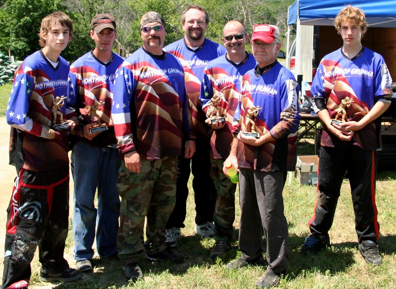 The Northrop-Grumman paintball team, ‘The Company’, stands proud as the winners of the Area 509 grand opening paintball tournament June 9. The Company won the tournament 4-1 in a best of seven competition against the ‘Shadow Brigade.’ They are: (from left to right) Robbie Gillaspie, Ethan Souder, Jeff Blake, Scott Gillaspie, Mark Andrews, Ken Gallagher and Mike Taylor. (U.S. Air Force photo/Staff Sgt. Jason Barebo)
