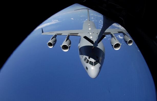 A C-17 Globemaster III receives fuel from a KC-135 Stratotanker during aerial refueling practice over the skies of Hawaii June 18, 2007. A KC-135 Stratotanker from the 909th Air Refueling Squadron, 18th Wing, Kadena Air Base, Japan is at Hickam Air Force Base, Hawaii practicing with a C-17 Globemaster III from the 535th Airlift Squadron for the Air Mobility Command Rodeo. (U.S. Air Force photo/ Tech. Sgt. Shane A. Cuomo)