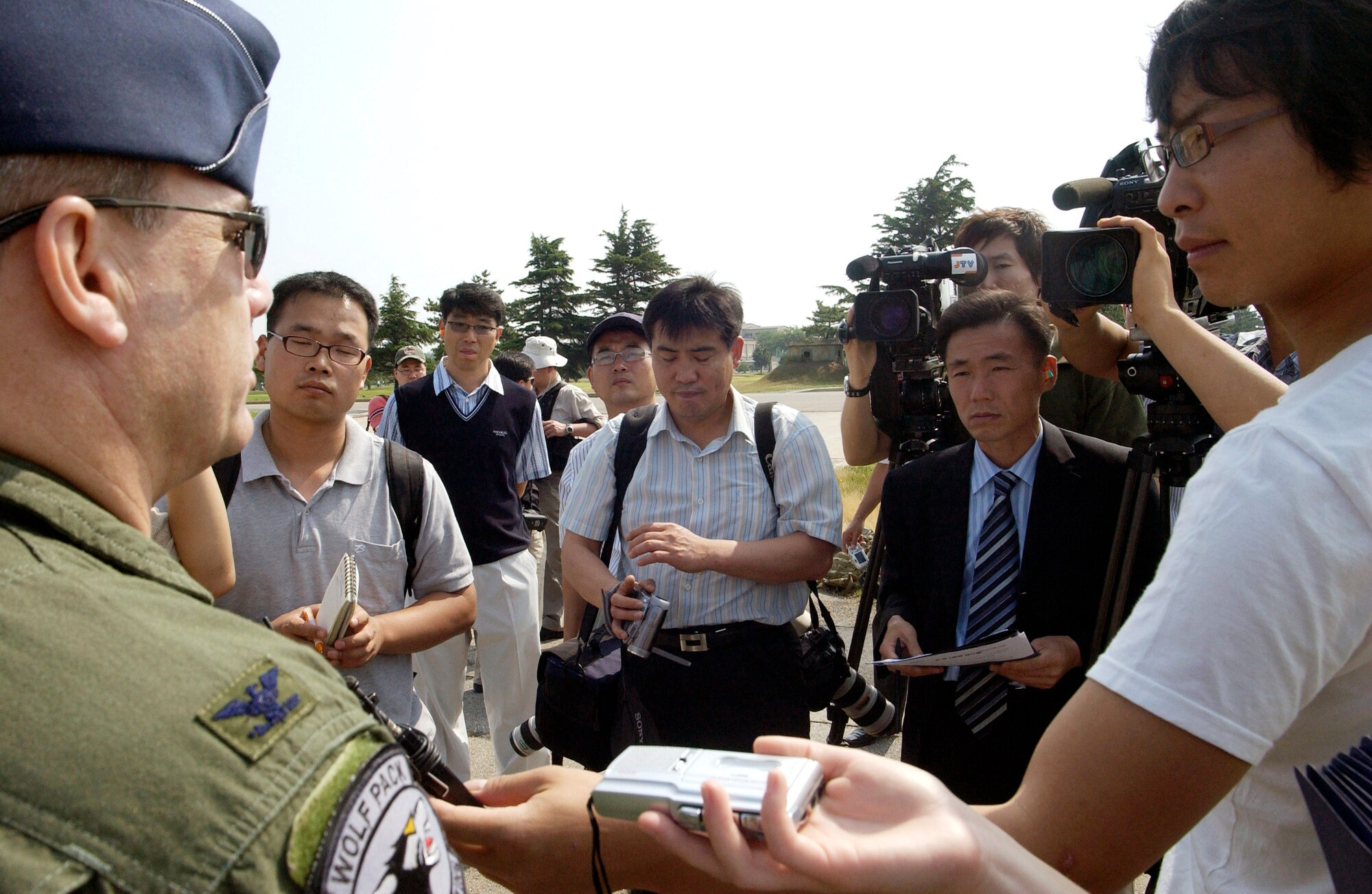 Col. Preston Thompson speaks to Korean media members regarding the arrival of F-16 Fighting Falcons from the 555th Fighter Squadron from Aviano Air Base, Italy, to Kunsan Air Base, South Korea. This is the first time a U.S. Air Forces in Europe fighter unit has deployed to a Pacific Air Force base. Colonel Thompson is the 8th Fighter Wing vice commander. (U.S. Air Force photo/Senior Airman Barry Loo) 