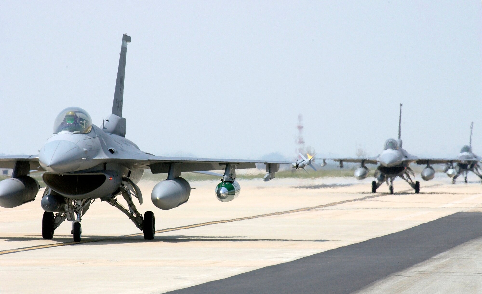 F-16 Fighting Falcons from the 555th Fighter Squadron from Aviano Air Base, Italy, arrive June 19 at Kunsan Air Base, South Korea. Airmen are here for a 120-day deployment. This is the first time a U.S. Air Forces in Europe fighter unit has deployed to a Pacific Air Force base.  (U.S. Air Force photo/Senior Airman Barry Loo)
