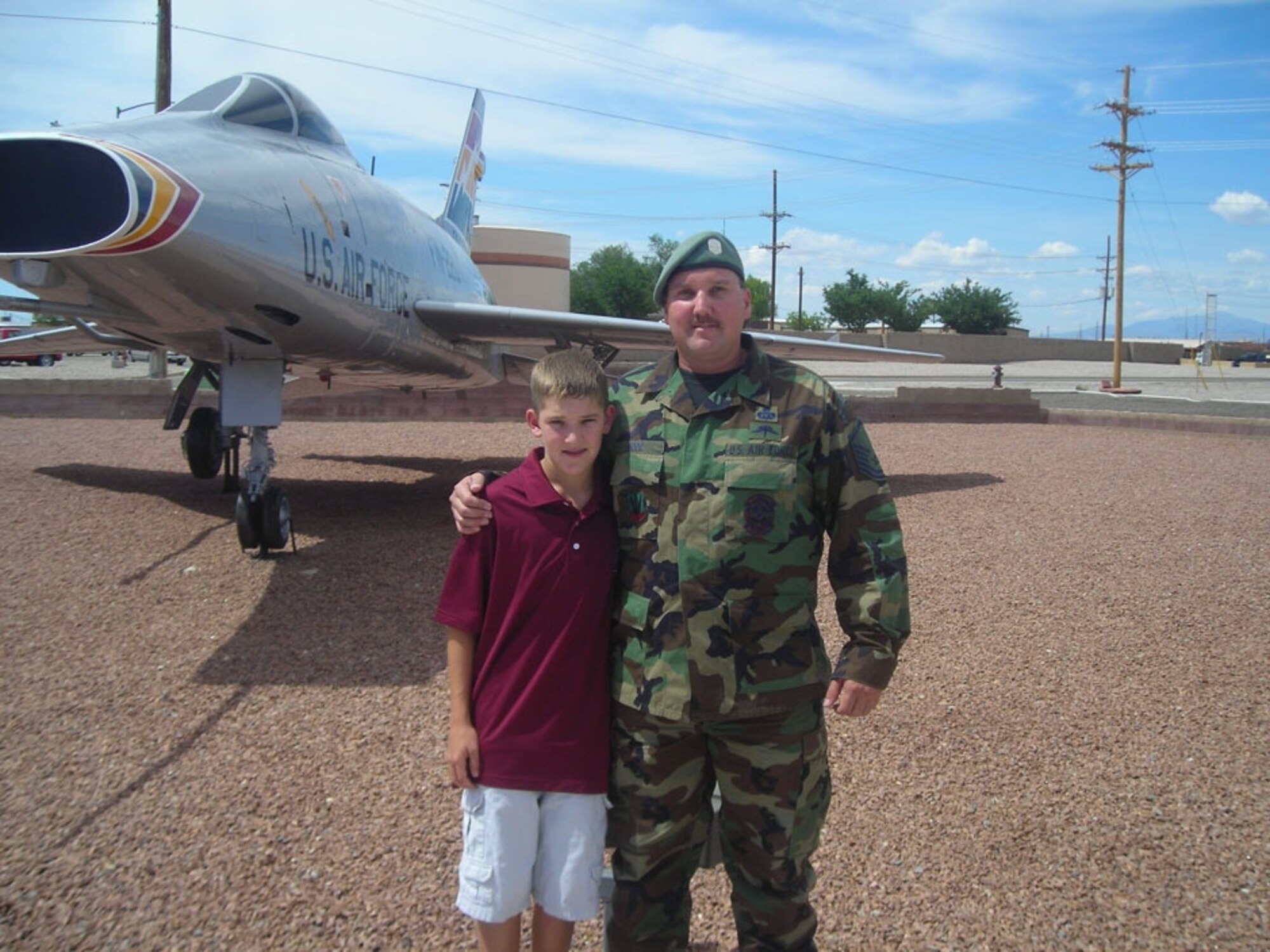 Twelve-year-old Alex Bood, pictured here with his father Master Sgt. Robert Bood, SERE superintendent for the 49th Operations Support Squadron, is getting the chance of a lifetime to travel as a student ambassador to Spain, France, Italy and Morocco. (U.S. Air Force photo/Airman 1st Class Heather Stanton)