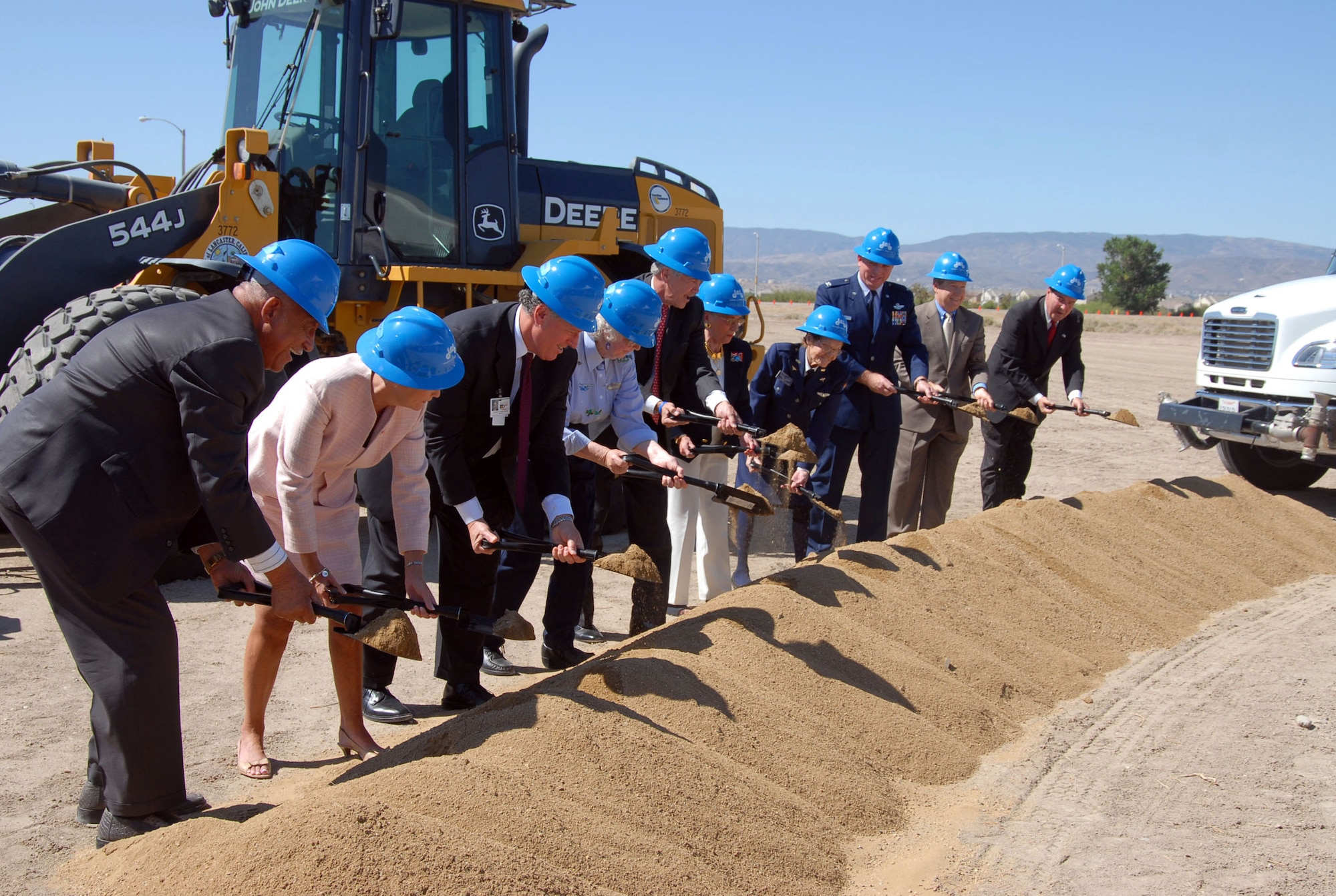 Special guests shovel dirt during the Lancaster, Calif., veterans home groundbreaking June 12. A contingent from Edwards provided support during the event. The veterans home, which features 60 beds with a 50-member capacity for adult health care, will give residential care for the elderly. (Photo by Airman 1st Class Stacy Sanchez)