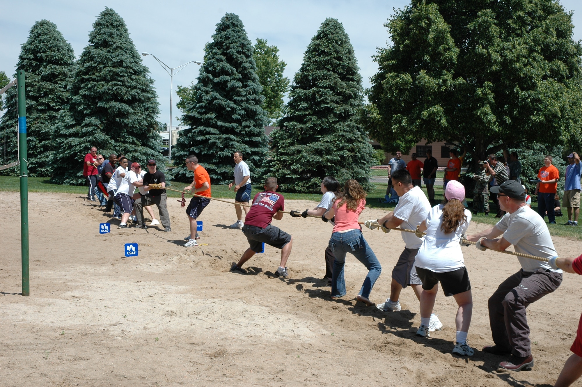 Tug-of-War was one of the many Sports and Field Day activities June 14. Here, Team OSS flexed their might, besting Team SFS. (U.S. Air Force photo by Matthew Cook)