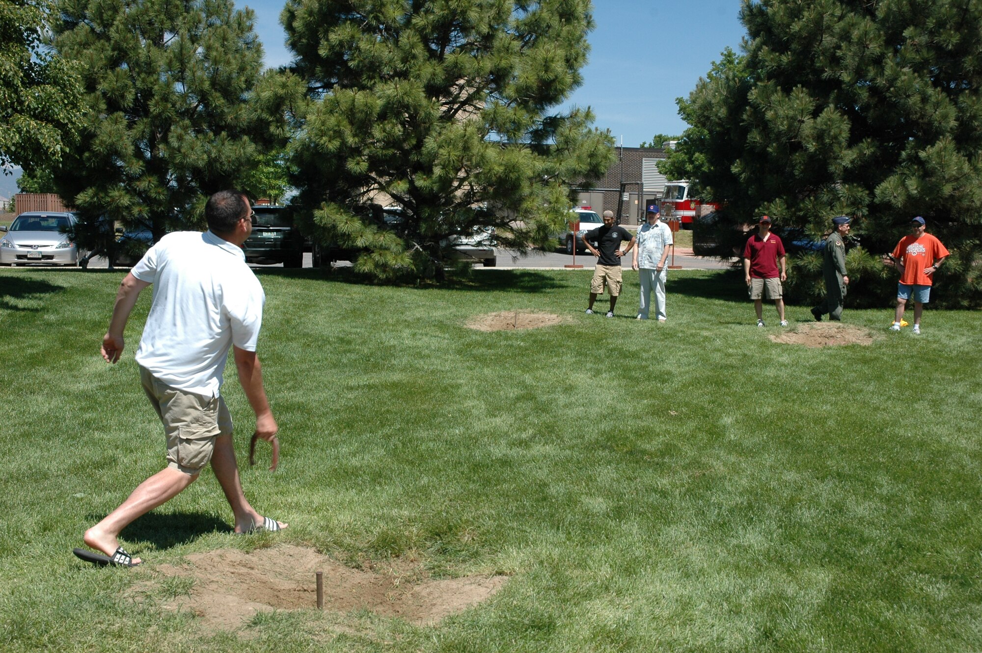Base employees get together at Eagle Park for fun in the sun in the horseshoe pits as part of Sports and Field Day June 14. (U.S. Air Force photo by Matthew Cook)
