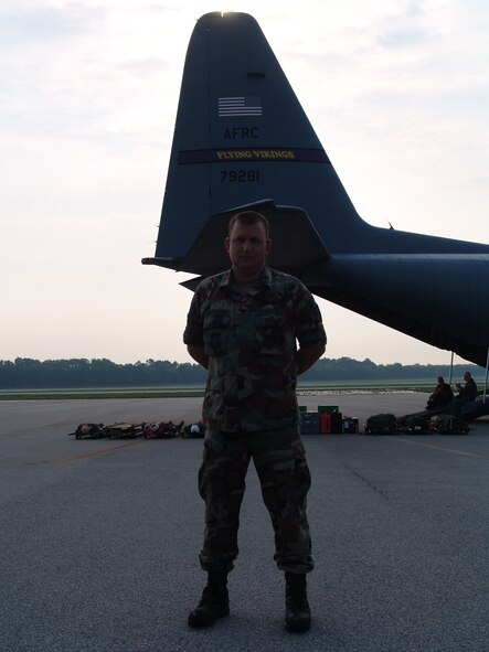 Tech. Sgt. Ben Rettman, 934th Aircraft Maintenance Squadron crew chief, Minneapolis-St. Paul International Airport Air Reserve Station, Minn., with the distinctive tail of the unit's "Flying Vikings" C-130 in the background, at the Augusta Regional Airport - Bush Field, Ga., in support of the Golden Medic Exercise 2007.