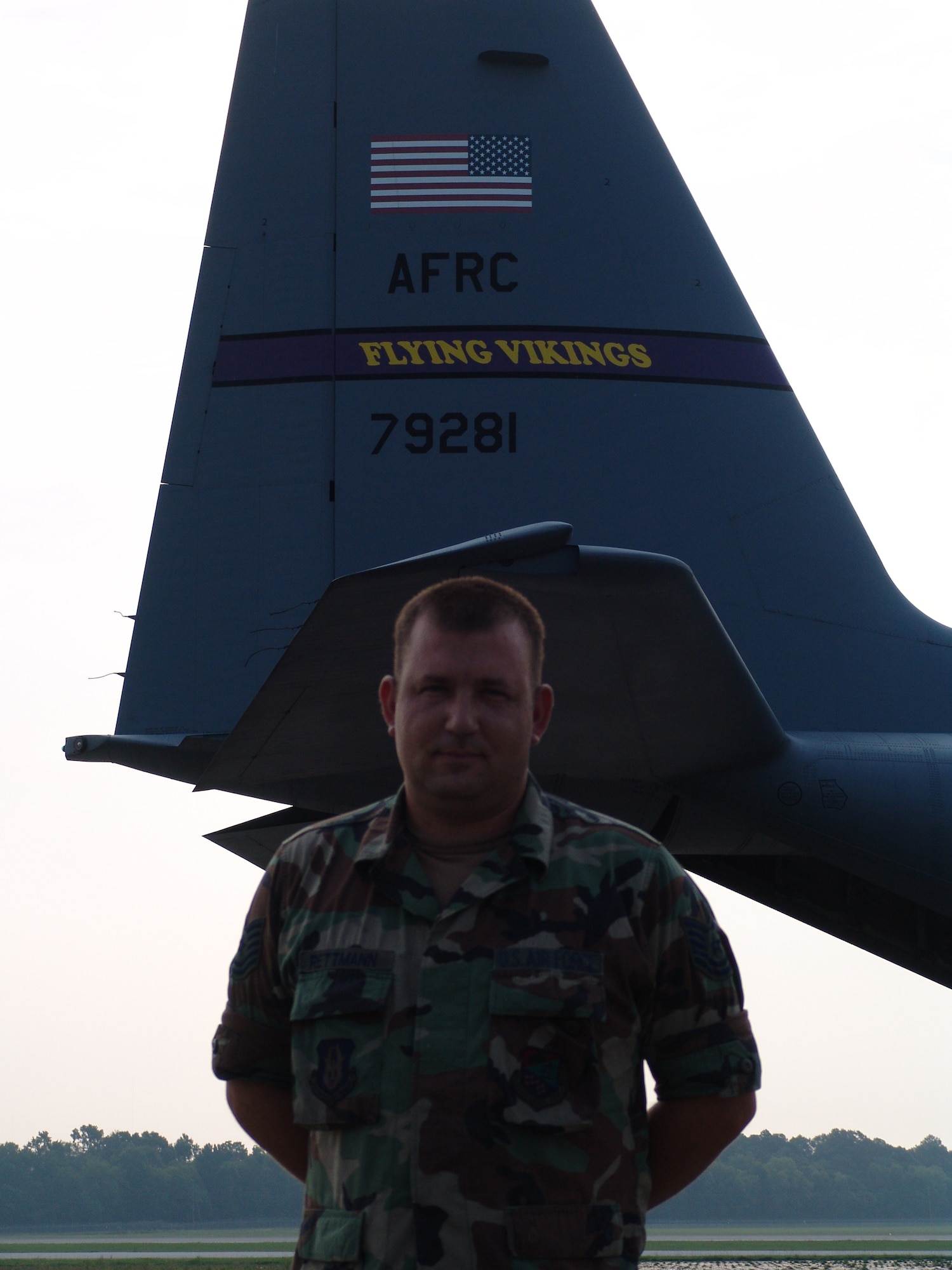 Tech. Sgt. Ben Rettman, 934th Aircraft Maintenance Squadron crew chief, Minneapolis-St. Paul International Airport Air Reserve Station, Minn., with the distinctive tail of the unit's "Flying Vikings" C-130 in the background, at the Augusta Regional Airport - Bush Field, Ga., in support of the Golden Medic Exercise 2007.