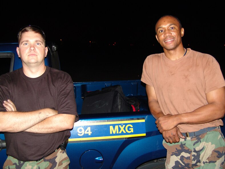Tech. Sgt. Keith Callahan (left) and Tech. Sgt. Gerald Peterson (right), both are aircraft pneudraulic technicians with the 94th Maintenance Squadron, Dobbins Air Reserve Base, Ga., who answered the call for help in repairing a broken brake on a C-130 during Golden Medic 2007 at the Augusta Regional Airport - Bush Field, Ga. 