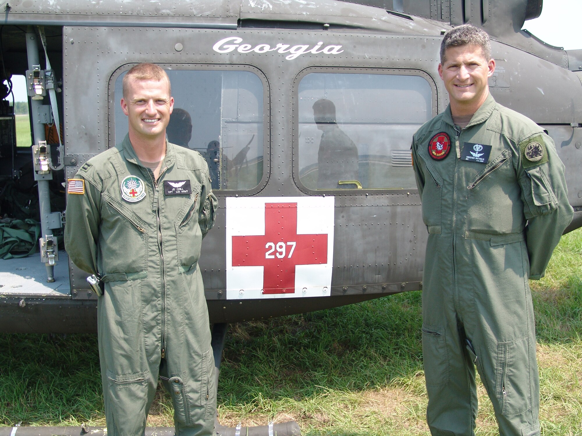 Capt. J.D. Crill (left), 832nd Medical Company Air Ambulance Detachment commander, and Sgt. 1st Class Vincenzo Battaglia, the detachment's NCOIC, pose next to helicopter number 297 of the Georgia Army National Guard, during the Golden Medic Exercise 2007 at the Augusta Regional Airport - Bush Field, Ga.