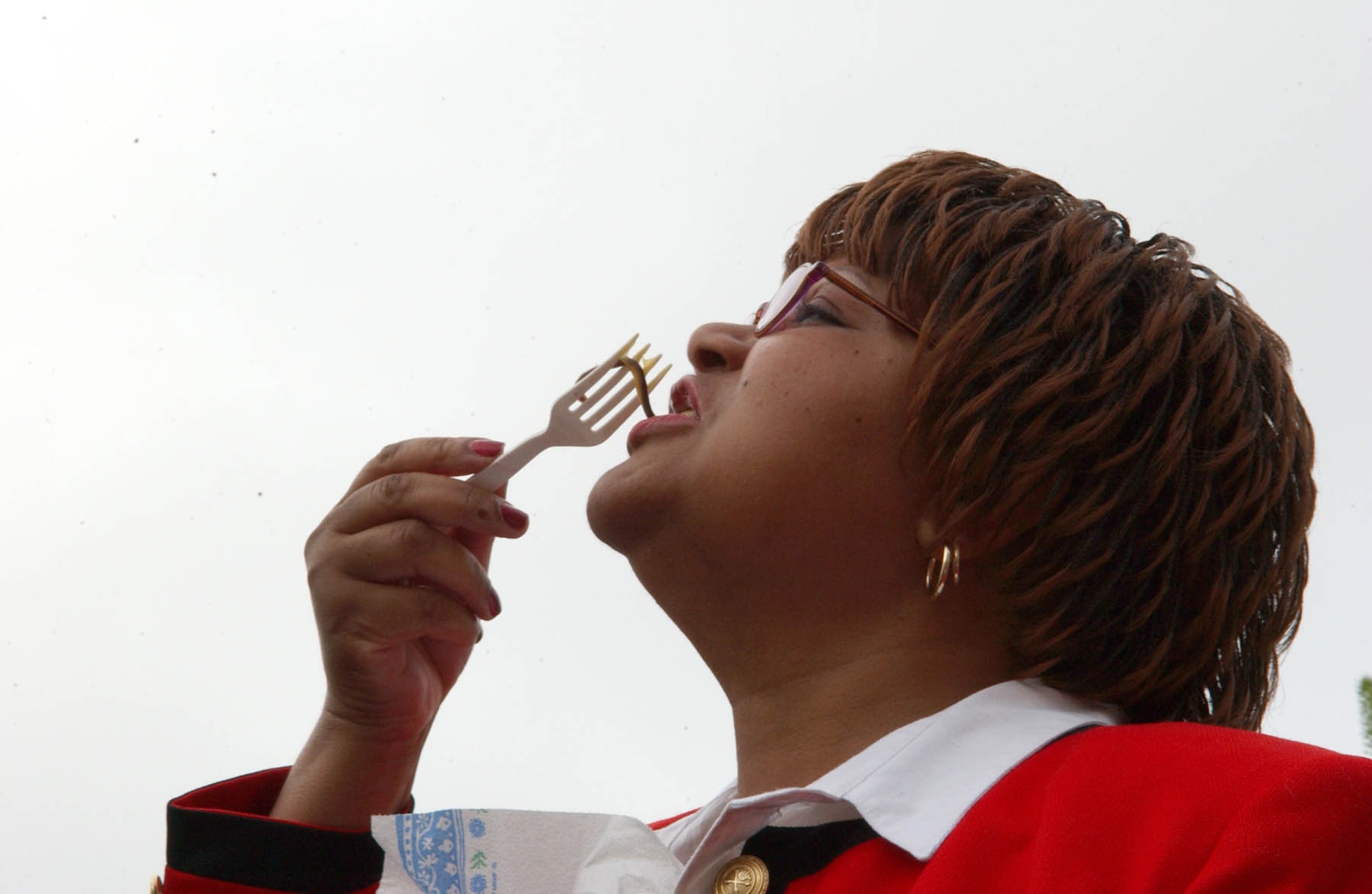SPANGDAHLEM AIR BASE, GERMANY -- Elizabeth Childs, Spangdahlem Middle School principal, ate three worms at the school as a tribute to the hard work of her students June 13. Mrs. Childs made a pledge to the students that she would eat one worm for every 1,000 box tops the students collected as part of a General Mills' Box Tops for Education. After the collected Box Tops are sent in, the school receives a check, equivalent to 10 cents for every Box Top. Schools can earn up to $60,000 per year for supplies. (US Air Force photo/Airman 1st Class Allen Pollard)