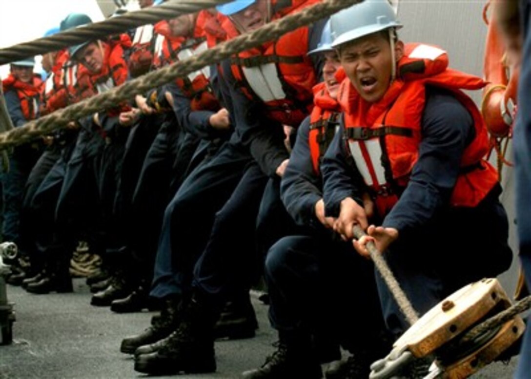 U.S. Navy Petty Officer 3rd Class Jeffrey Dayot and sailors assigned to the USS Stethem (DDG 63) heave on a line to connect Stethem and the Military Sealift Command fleet replenishment oiler USNS Guadalupe (T-AO 200) for an underway replenishment in the Pacific Ocean on June 17, 2007.  The two ships are taking part in exercise Talisman Sabre 2007, a biennial exercise designed to train Australian and U.S. forces in planning and conducting combined task force operations, which will help improve combat readiness and interoperability.  