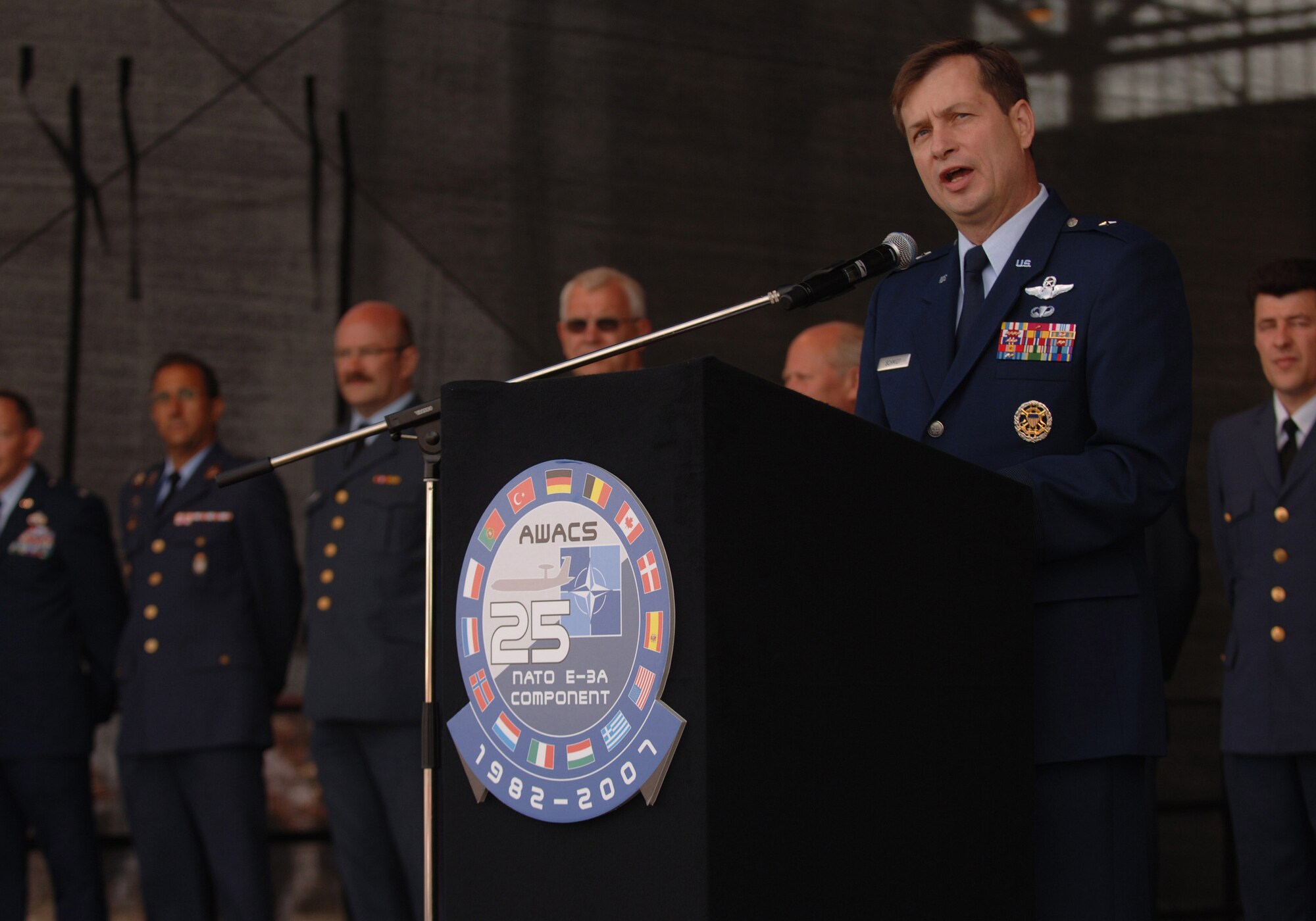 Brig. Gen. Stephen P. Schmidt speaks to several thousand German, Belgian and Dutch citizens June 16 at Geilenkirchen NATO Air Base, Germany, during the 25th anniversary celebration of the aircraft's initial operations out of the NATO installation. General Schmidt is the NATO E-3 AWAC component commander. (U.S. Air Force photo/Master Sgt. Scott Wagers)
