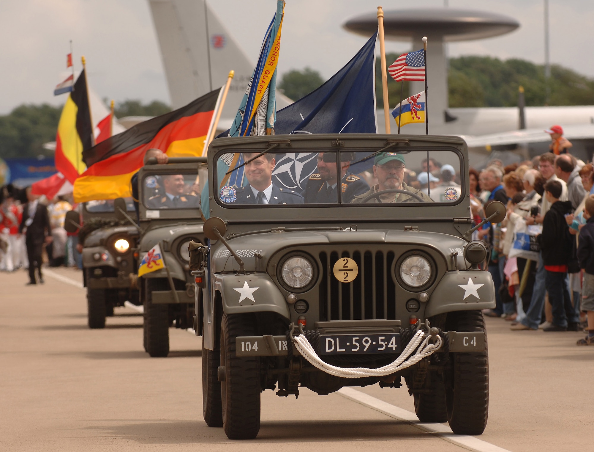 Brig. Gen. Stephen P. Schmidt rides at the front of a multinational force parade before several thousand German, Belgian and Dutch citizens June 16 at Geilenkirchen NATO Air Base, Germany, during the 25th anniversary celebration of the aircraft's initial operations out of the NATO installation that began in February 1982. General Schmidt is the NATO E-3 AWAC component commander. (U.S. Air Force photo/Master Sgt. Scott Wagers)
