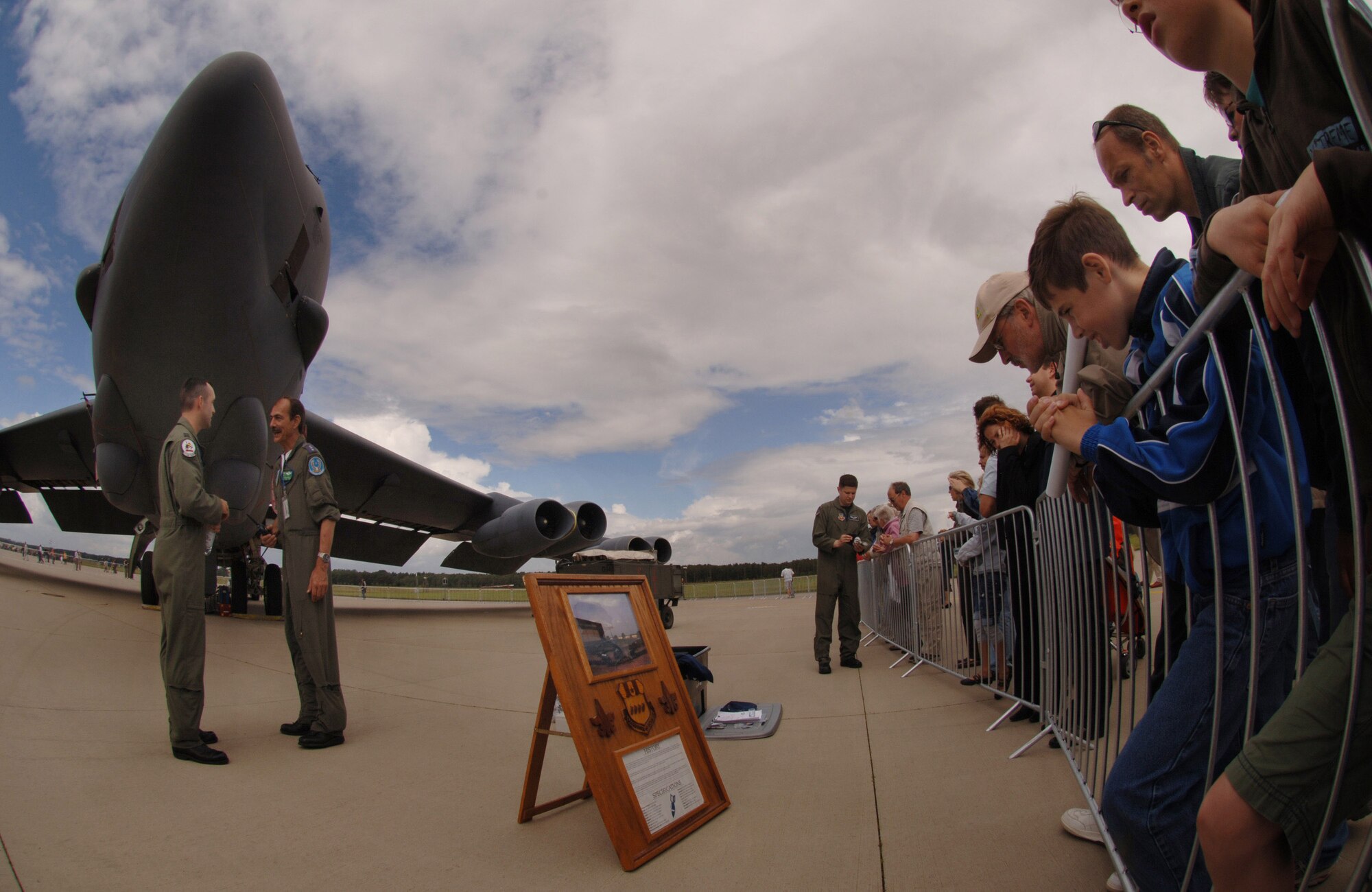 A B-52 Stratofortress from the 20th Bomb Squadron at Barksdale Air Force Base, La., stands on display at a 25th anniversary celebration of the E-3 NATO AWACS initial operations June 16 at Geilenkirchen NATO Air Base in northern Germany. On hand to field questions about the 47-year-old bomber was Capt. David Isakson, the aircraft commander, (left) and 1st Lt. John Stephens, a radar navigator. (U.S. Air Force photo/Master Sgt. Scott Wagers)
